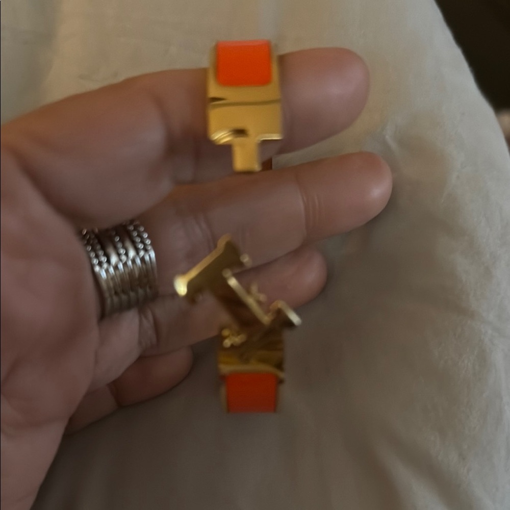 Stylish Gold Bracelet with Orange Highlights